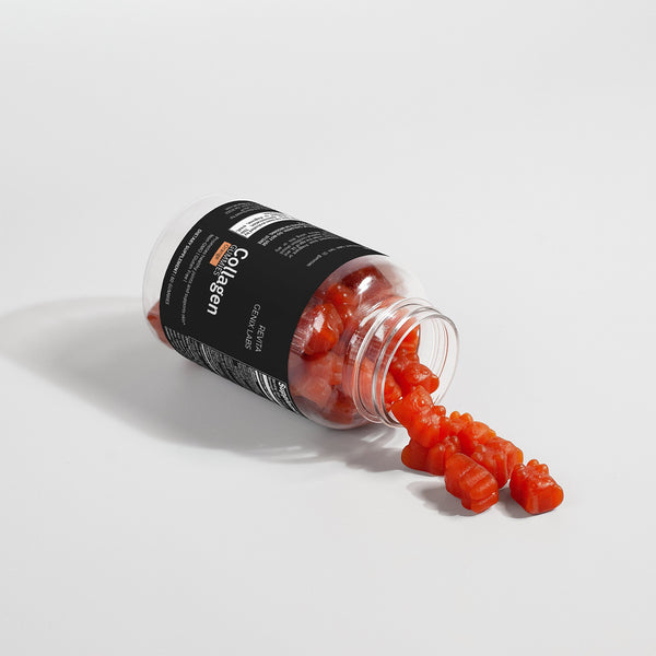 Revita Genix Labs natural collagen supplement bottle with red gummy bears spilling out