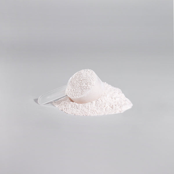 Scoop of white powdered amino acids from Ignite-NO performance booster by Revita Genix Labs
