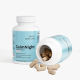 Revita Genix Labs CalmNight sleep support capsules bottle with some capsules spilled out on white background