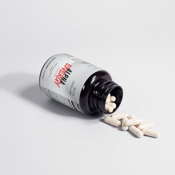 RevitaGenix Labs men's vitality and wellness pills white capsules spilling from black bottle