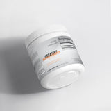Revita Genix Labs pure creatine monohydrate supplement in a white container for fitness support