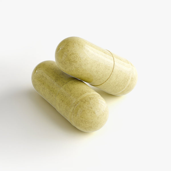 Two yellow capsules of premium NAD Resveratrol supplements by Revita Genix Labs on white background